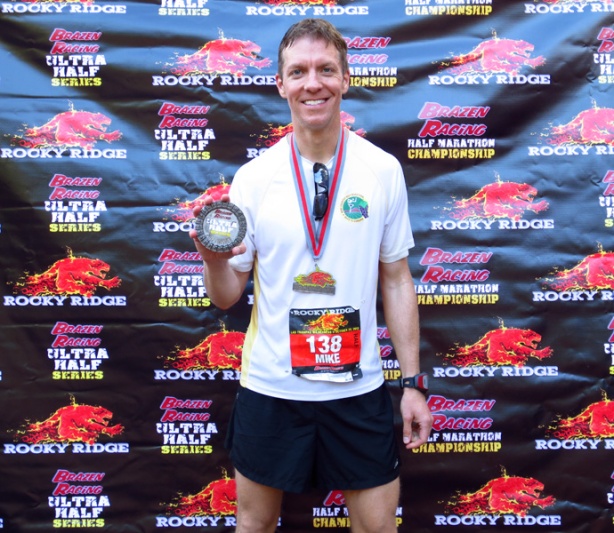 Mike Sohaskey with finisher's & Ultra-Half Series medals at Rocky Ridge Half Marathon