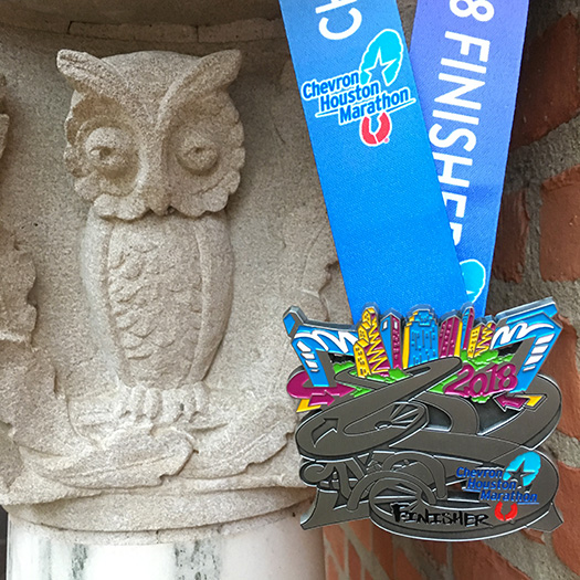 Houston Marathon medal with Rice University owl