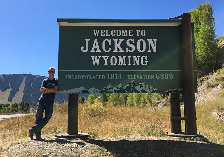 Mike Sohaskey by Welcome to Jackson WY sign