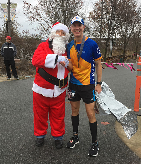 Mike Sohaskey & Santa Claus at the 3 Bridges Marathon finish