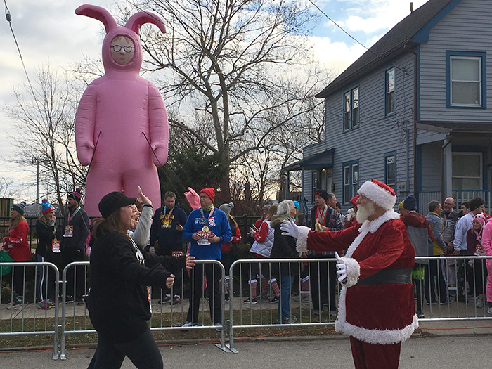 Santa welcoming runners at A Christmas Story 5K finish line
