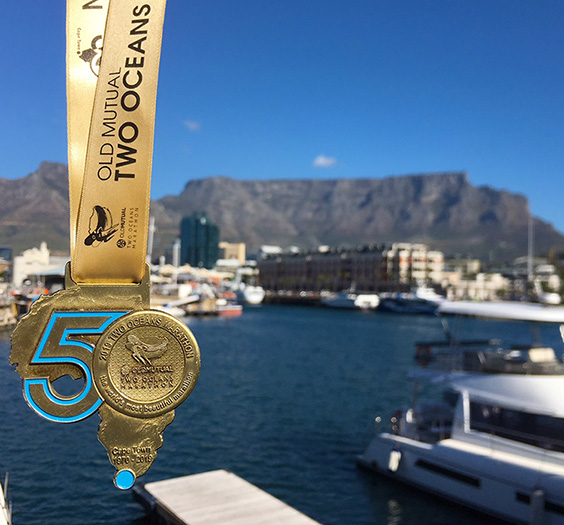 Two Oceans Marathon medal with Table Mountain backdrop