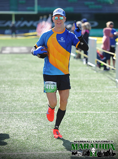 Mike Sohaskey about to cross finish line of Marshall University Marathon
